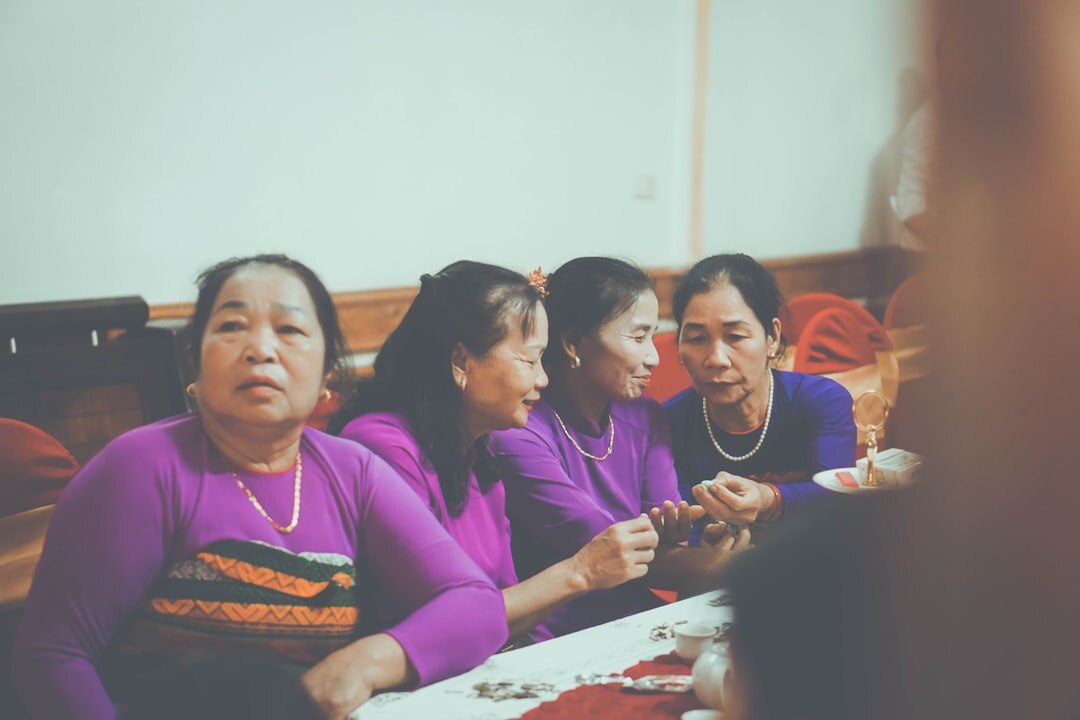 Group of people having a conversation around a table