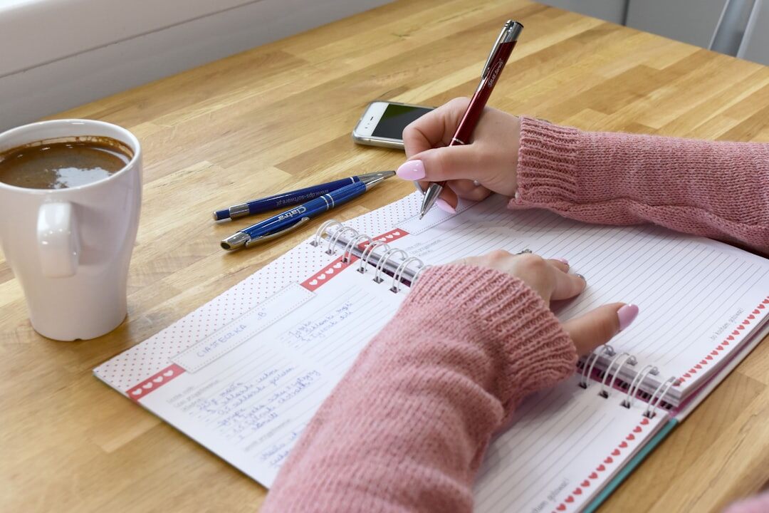 person journaling at home
