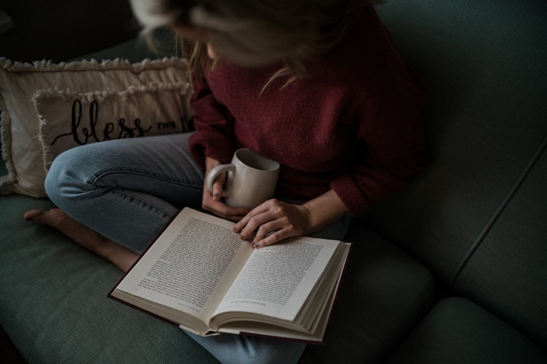 person reading self help book