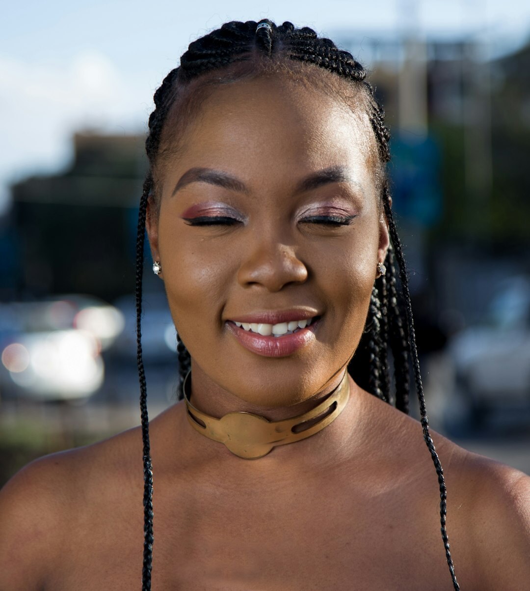 Portrait of a woman with braided hair smiling
