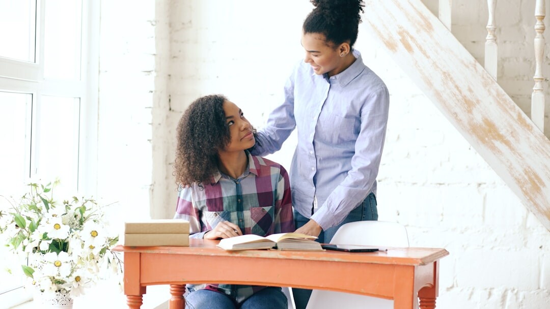 person reading book at desk