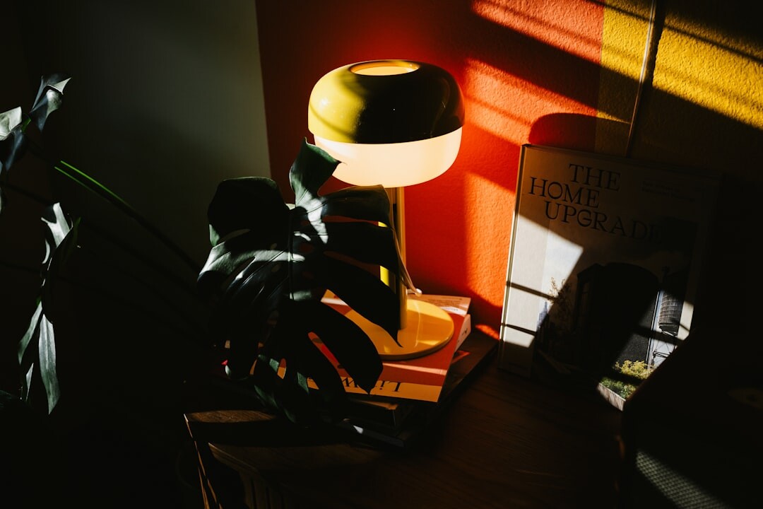person reading book at desk